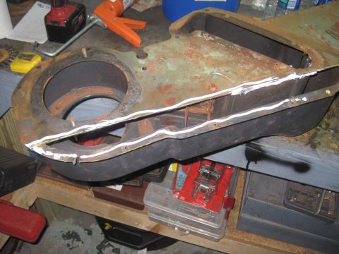 1979 Ford Bronco - Heater box assembly being repaired with sealant applied to its seams.