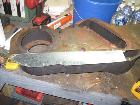 1979 Ford Bronco - Close-up of a rusty, possibly damaged, HVAC duct assembly with a metal repair plate.