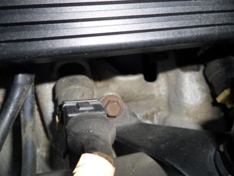1994 Jeep Cherokee - Close-up view of an engine sensor and its wiring harness.