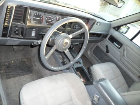 1994 Jeep Cherokee - Interior view of a 1994 Jeep Cherokee, highlighting the dashboard and seating.