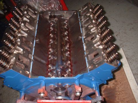 1969 Ford Mustang - Engine block with valve springs and pushrods visible, set on a stand.