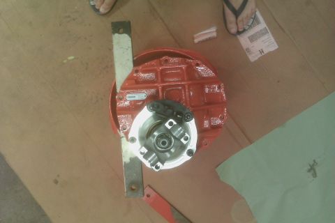1999 Chevrolet Camaro - A red differential housing is shown from above, resting on a wooden surface.