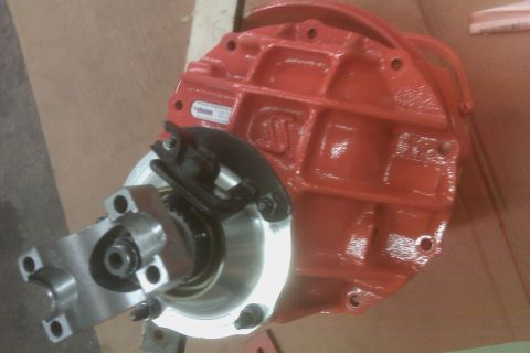1999 Chevrolet Camaro - A red differential housing is shown with a silver mounting bracket and brake assembly attached. The part appears to be new or recently refu…