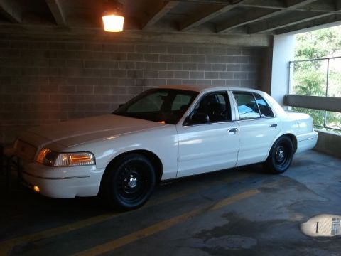 1998 Ford Crown Victoria - White 1998 Ford Crown Victoria in a parking garage.