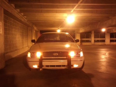 1998 Ford Crown Victoria - This 1998 Ford Crown Victoria is equipped with a push bumper and is shown head-on in a parking garage.