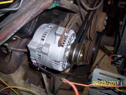 1973 Ford F-250 - Engine bay view of an alternator and pulley system, likely from an older vehicle.