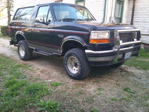 1994 Ford Bronco - This 1994 Ford Bronco is parked outside a house on a sunny day.