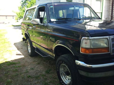 1994 Ford Bronco - This 1994 Ford Bronco is parked in front of a house on a sunny day.