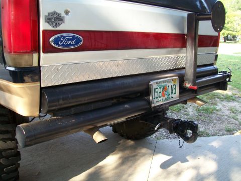 1990 Ford Bronco - Rear view of a 1990 Ford Bronco, showing custom bumper and tailgate details.