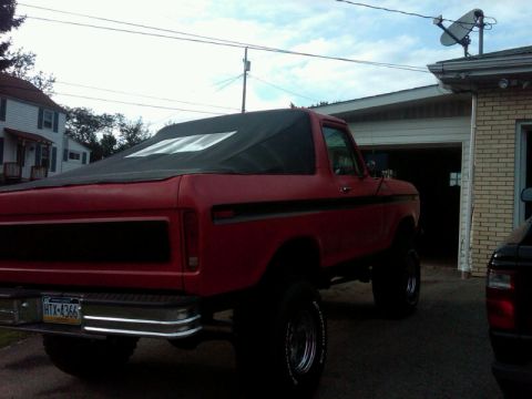 1979 Ford Bronco - This red Ford Bronco appears to be a 1978 model, not a 1979 as claimed, based on its body style.