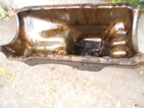 1979 Ford Bronco - This is an oil pan, likely removed from a vehicle for maintenance or replacement.