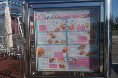 1991 Ford LTD Crown Victoria - Photograph of a diner menu display board; a food menu, not a vehicle technical document.