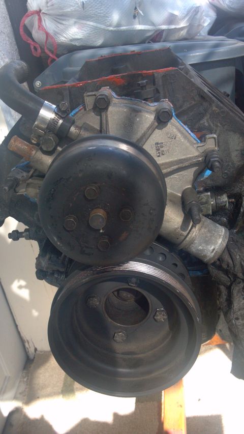 1990 Ford Bronco - This image shows a close-up view of an engine's water pump and associated pulleys.