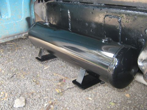 1972 Ford F-250 - Close-up of an air tank installed beneath the bed of a blue pickup truck.