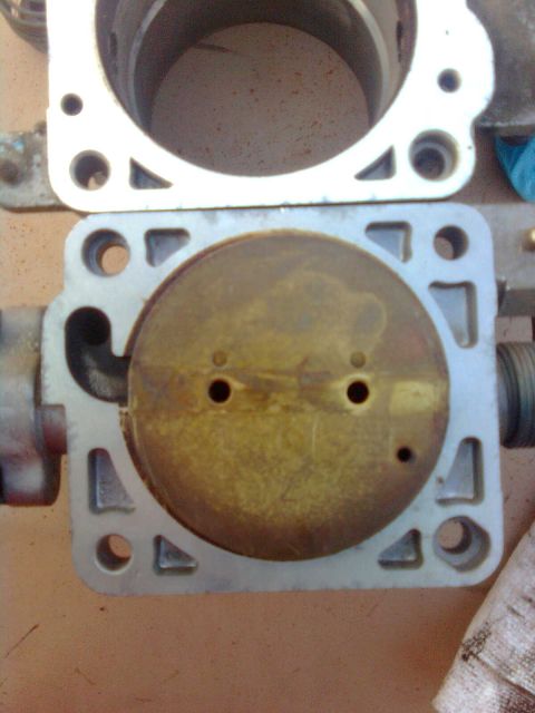 1984 Ford Bronco - Thats the 5.4 butterfly over the 4.6 hole. Yes, it is quite a bit larger...NO, I did not measure it to find out.