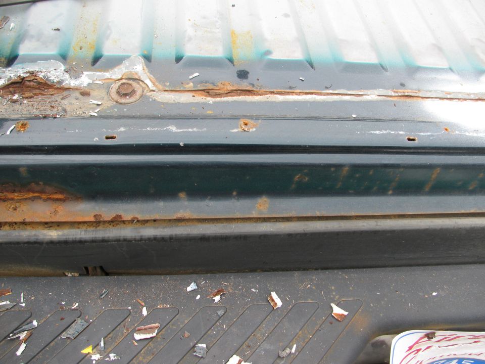 Rust on rear, along line of rear and rear bed along spot weld line