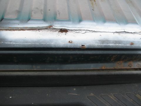 1992 Ford Bronco - Rust on rear, along line of rear and rear bed along spot weld line