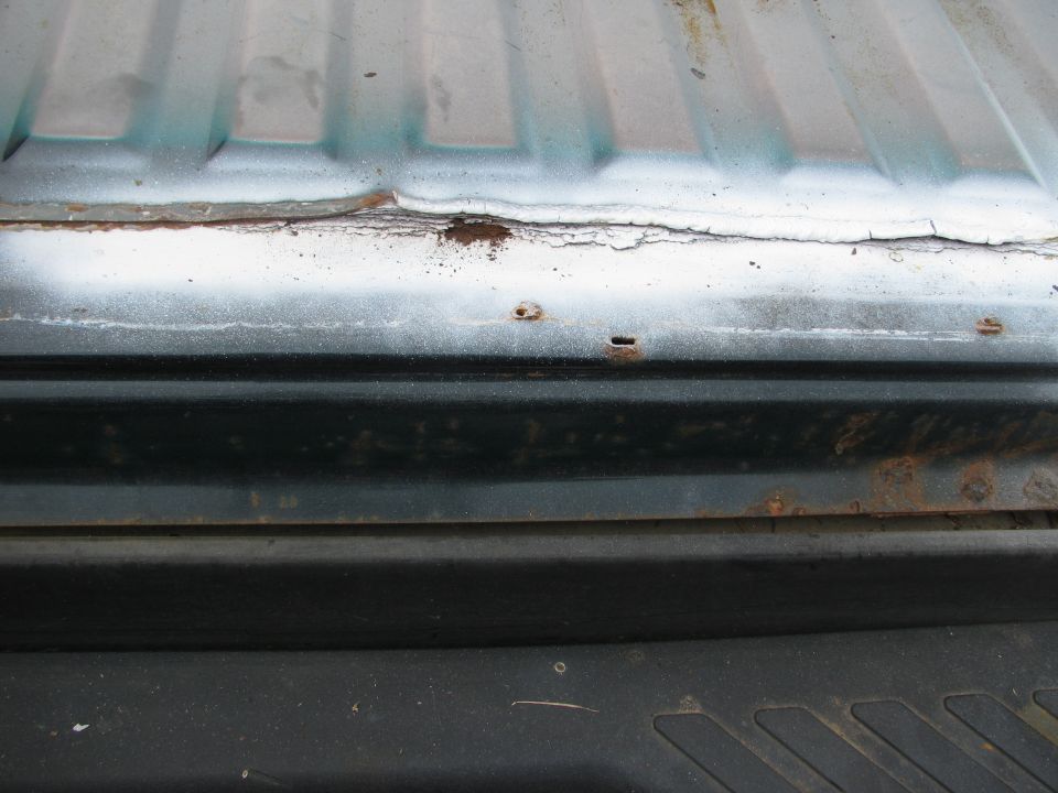 Rust on rear, along line of rear and rear bed along spot weld line