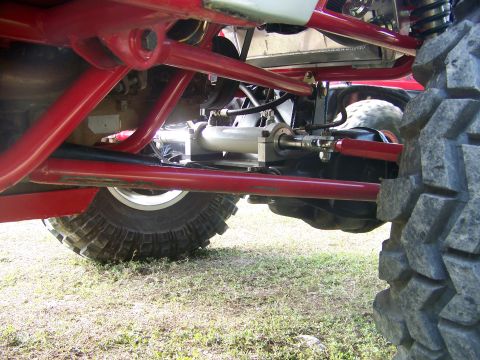 2001 Dodge 1500 - Close-up view of the undercarriage and suspension system of a modified off-road vehicle.