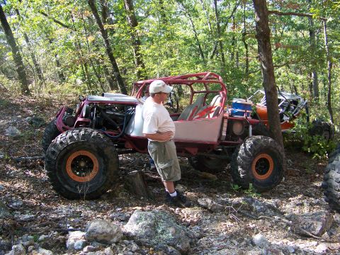 2001 Dodge 1500 - Custom off-road buggy with a man standing beside it in a wooded area.