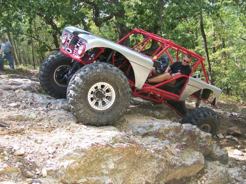 2001 Dodge 1500 - A heavily modified off-road buggy navigates a challenging rocky trail.