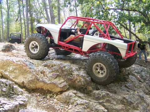 2001 Dodge 1500 - This custom buggy navigates a rocky trail, with another vehicle visible in the distance.