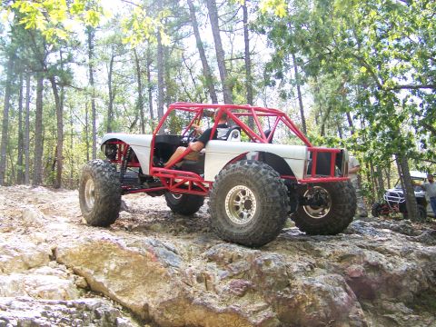 2001 Dodge 1500 - Custom buggy navigates a rocky trail with another vehicle in the distance.