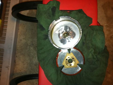 1981 Garelli Rally Sport - A disassembled clutch assembly, metal and brass components, is laid out on a green cloth.