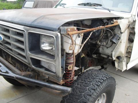 1986 Ford Bronco - Front view of a disassembled 1980 Ford Bronco, showing the grille and suspension components.
