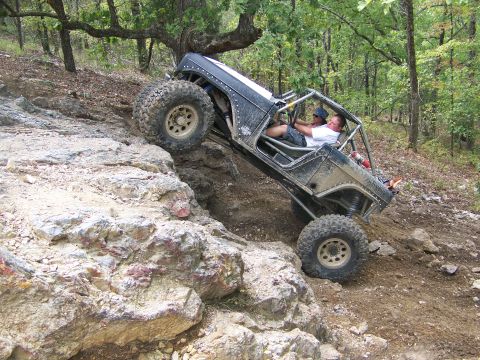 2001 Dodge 1500 - Two people are inside the buggy as it navigates a difficult off-road trail.