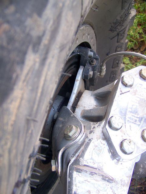 2001 Dodge 1500 - Detail shot of aftermarket suspension parts on a truck, showing the brake assembly and tire.