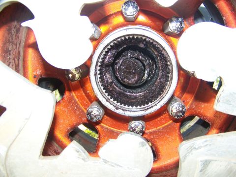 2001 Dodge 1500 - The wheel hub assembly shows significant grease buildup and wear.
