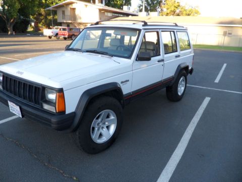 1994 Jeep Cherokee - This 1994 Jeep Cherokee is shown in a three-quarter front view, parked in an outdoor lot.