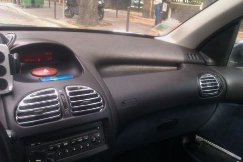 1991 Ford LTD Crown Victoria - The dashboard of a car is shown, with a digital display and air vents visible.