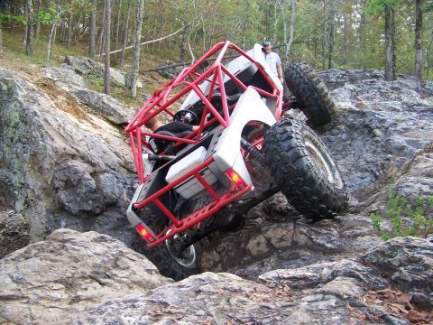 2001 Dodge 1500 - This heavily modified off-road vehicle navigates a challenging rocky terrain.