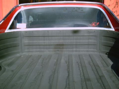 1979 Chevrolet El Camino - Rear view of a red 1978 Chevrolet El Camino, focusing on the truck bed and rear window.