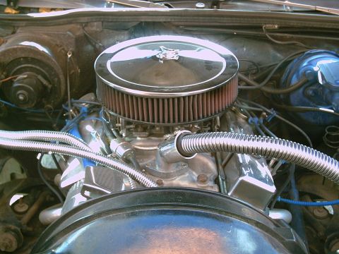 1979 Chevrolet El Camino - Close-up view of a modified engine bay, a prominent chrome air cleaner and braided hoses.