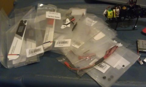 1992 Ford Ranger - Various RC helicopter parts, including tail rotor blades, are laid out in plastic packaging.