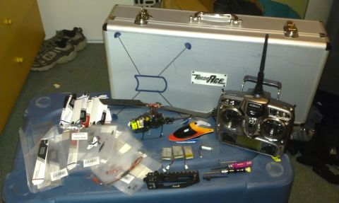 1992 Ford Ranger - Various components and a remote control helicopter are displayed on a table, ready for assembly or use.