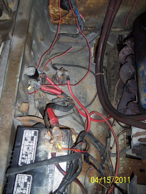 1973 Ford F-250 - Close-up of engine bay wiring and battery, showing red cables and a 'Medalist 72' battery.