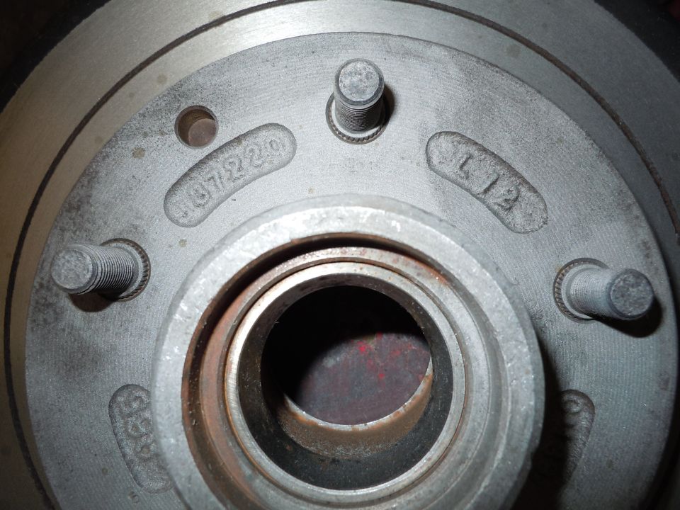 Brake rotor with stamped numbers '07/22/0' and 'L12'