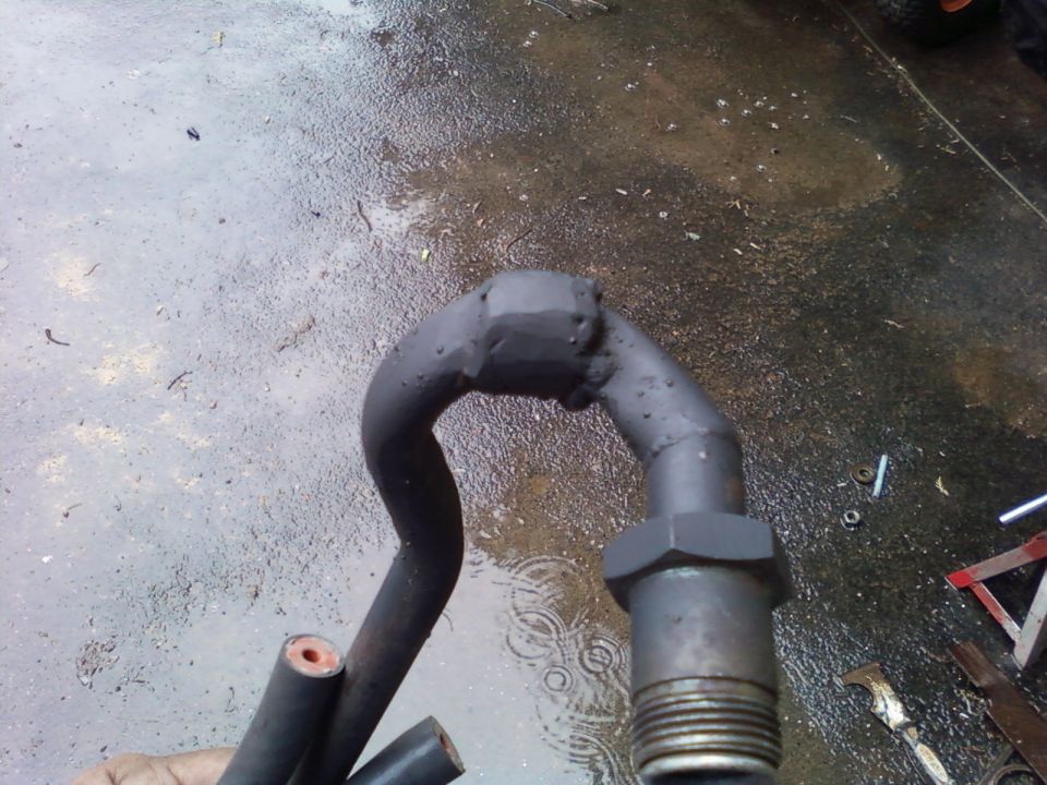 The sleeve was used so I could align the pieces while tacking together in-car.

It's ugly as hell (especially after the quick and dirty grinding lol) but effective. It is all covered by the stock fiberglass heat sleeve anyway.