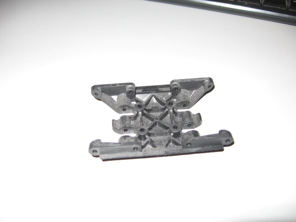 Metal chassis part for an RC car, looks like a suspension mount