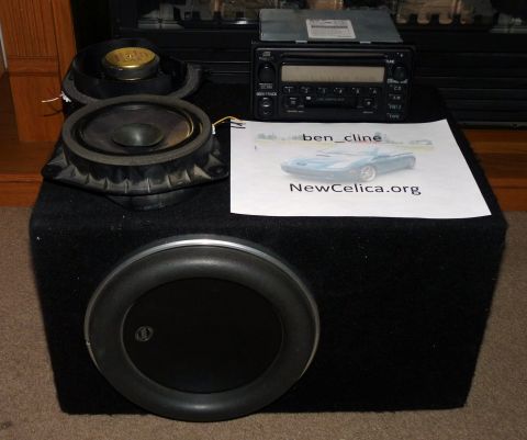 2006 Ford E350 - Car audio components including a subwoofer, speakers, and stereo are displayed with a printed image of a blue car.