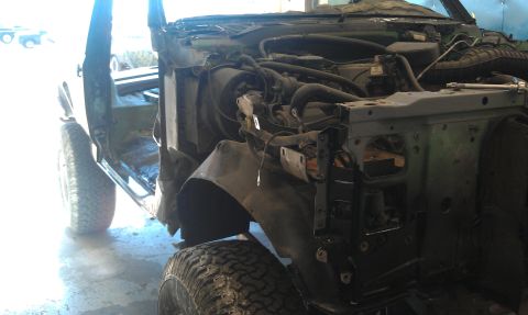 1995 Ford Bronco - This 1995 Ford Bronco is undergoing repairs, with its front end partially dismantled.