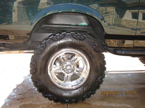 1996 Ford Bronco - Detail shot of the tire and wheel well on a 1996 Ford Bronco.