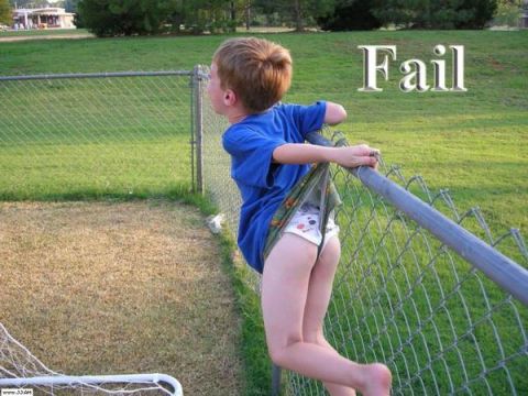 1989 Ford Bronco - A young boy attempts to climb over a fence, revealing his patterned underwear.