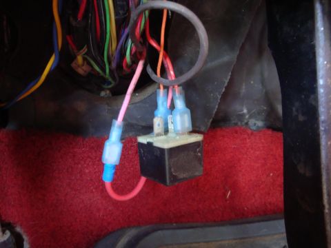 1989 Ford Bronco - Close-up of an automotive electrical relay and its wiring harness.