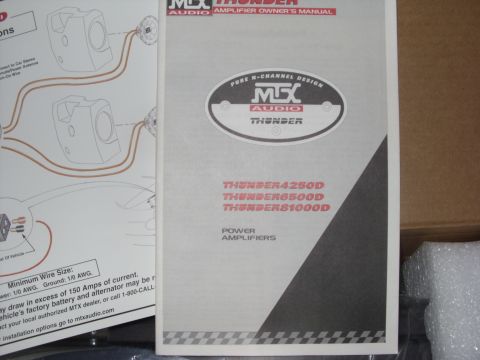 2006 Ford E350 - The photo shows an MTX Audio amplifier owner's manual and a wiring diagram.