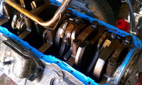 1985 Ford Bronco - Close-up view of an engine's internal components, including the crankshaft and connecting rods.